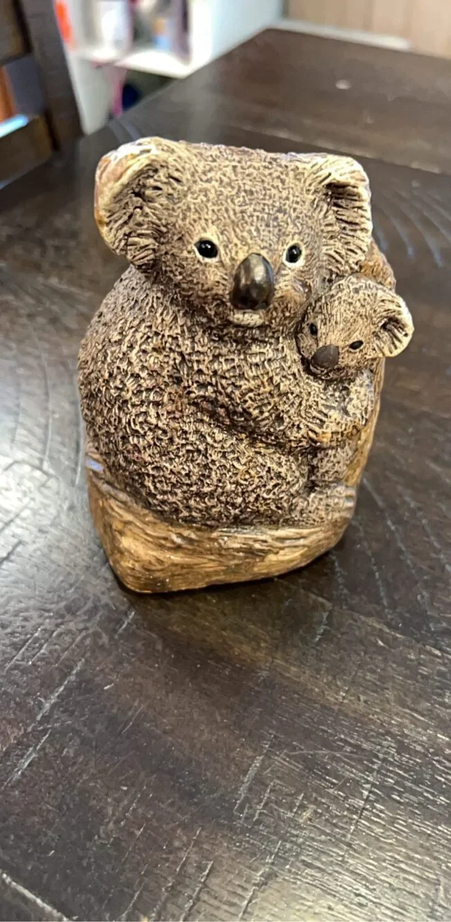 1982 Bandanna Sculptures and cub figurine made of a textured stone-like material